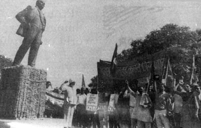 Senior members of Communist Party of India (M) giving the red salute near the statue of Lenin in Delhi